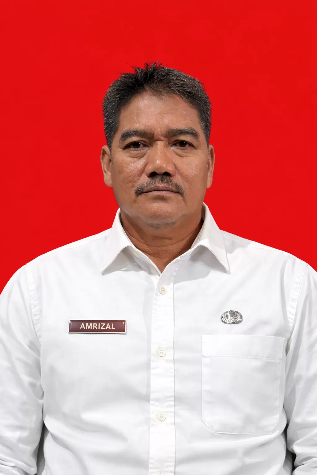 Drs. AMRIZAL, M.H.